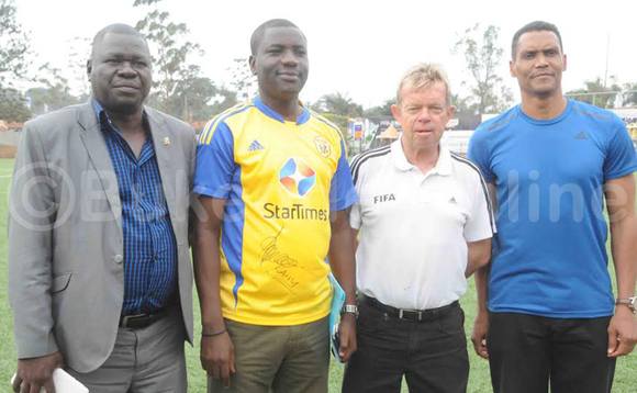 Omukungu wa CAF Ian McLeod (owokubiriku ddyo) ng'ali n'abakungu ba FUFA ne KCCA FC. Ku kkono Dr.Patrick Ogwel owa FUFA, David Tamale owa KCCA FC nga ku ddyo ye CEO wa FUFA Watson Edgar . (ekif:Silvano Kibuuka) Omukungu wa CAF Ian McLeod (owokubiriku ddyo) ng'ali n'abakungu ba FUFA ne KCCA FC. Ku kkono Dr.Patrick Ogwel owa FUFA, David Tamale owa KCCA FC nga ku ddyo ye CEO wa FUFA Watson Edgar . (ekif:Silvano Kibuuka)
