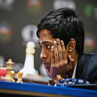 R Praggnanandhaa plays a game of chess with Adani Group chairperson Gautam Adani