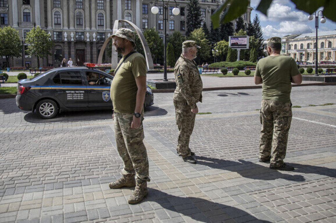 Ukrainian draft enforcers snatch teacher in front of students 
