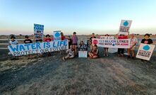 The activists at the gate to the rail corridor with Kit Tomlinson in the centre.