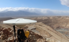  An integrated monitoring setup using Trimble Zephyr 3 Geodetic GNSS antenna and Trimble Monitoring prism overlooking an openpit mine