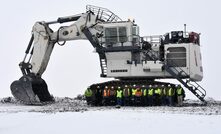 Trapper mine and Liebherr staff in front of the new R 9400 excavator