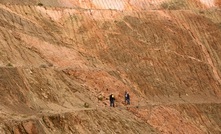 Alto Metals staff examining the felsic porphyry contact in the Lord Nelson pit