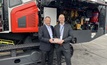  Steve Ferguson, senior vice president of Caterpillar Industrial Power Systems (left), presents a plaque celebrating the 10,000-engine milestone to Petri Virrankoski, president of the Surface Drilling Division of Sandvik Mining and Rock Solutions