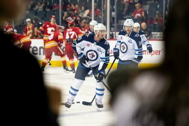 Jonathan Toews' first goal for Jets sparks comeback over Flames