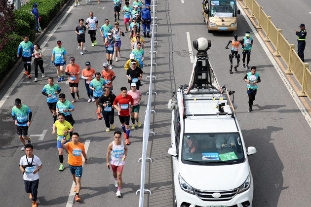 InPics: World's first humanoid robot half-marathon held in Beijing