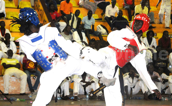 Freddy Kangendo (ku kkono) nga yeeriga ne Royson Okwera owa Uganda mu mpaka za Tae Kwondo eza Korean Ambassadord Cup e Lugogo nga May 28 2017. Kangendo yawangudde ku bubonero 19-05.(ekif: Silvano Kibuuka) Freddy Kangendo (ku kkono) nga yeeriga ne Royson Okwera owa Uganda mu mpaka za Tae Kwondo eza Korean Ambassadord Cup e Lugogo nga May 28 2017. Kangendo yawangudde ku bubonero 19-05.(ekif: Silvano Kibuuka)