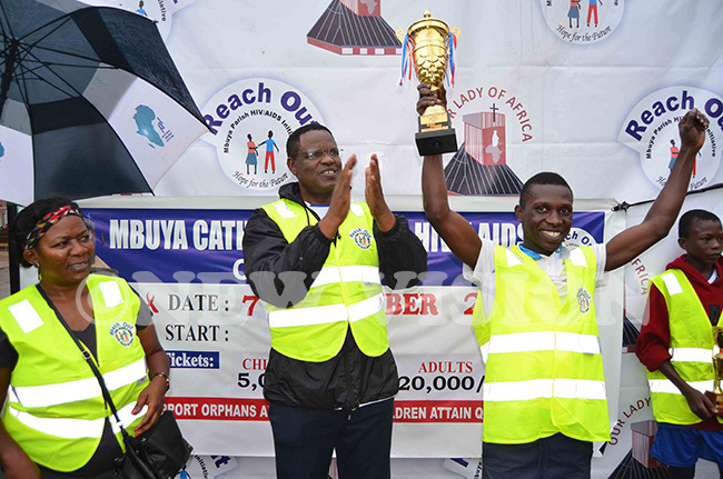  ne of the winners jubilating after receiving a trophy