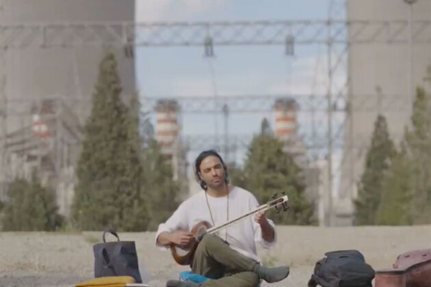 Iranian musician Ali Ghasmari performs outside Damavand power plant after Trump threat to target key infra
