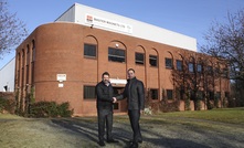 Simon Ayling and Adrian Coleman, general manager of Master Magnets, outside the Master Magnets manufacturing facility