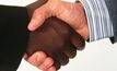 OZ, Minmetals shake hands over sale terms