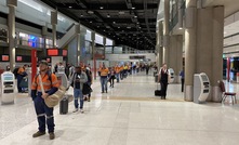 Workers preparing to fly out of Brisbane Airport.