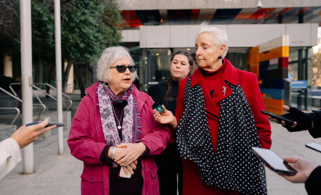 Friends of Australian Rock Art co-convenors Judith Hugo (L) and Susan Swain (R) talk to press outside Federal Court in Melbourne