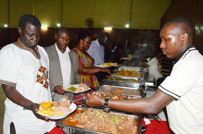  uests being served dinner during the fundraising function 