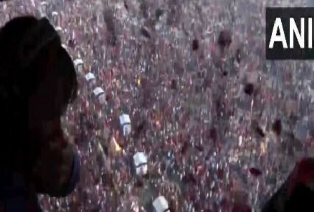 Prayagraj: Flower petals showered on devotees taking holy dip at Triveni Sangam on Magh Purnima