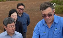 Roger Cook (left) receiving a briefing on the Port Hedland Iron project.