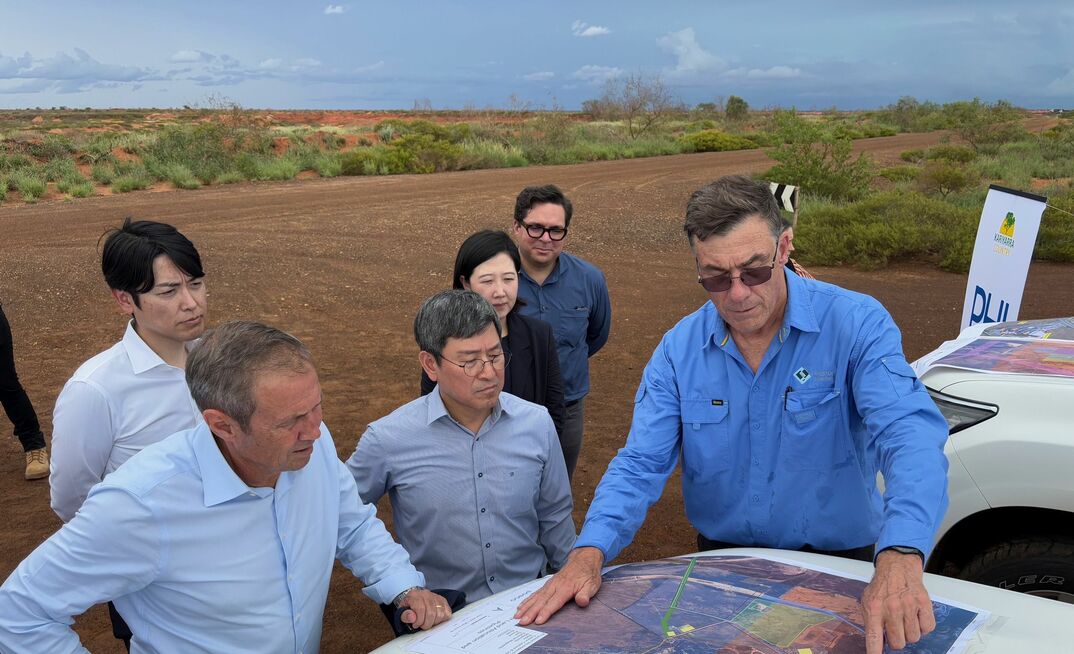 Roger Cook (left) receiving a briefing on the Port Hedland Iron project.