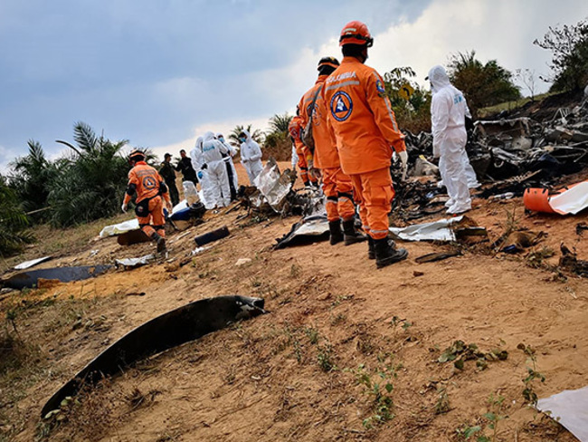 hoto released by olombias ivil efense press service showing members of civil defense at the site of a plane 3 crash  hoto