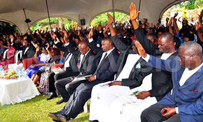   he family of the late amsom uwanguzi proprietor of ido beach ntebbe together with other mourners pray for the lates soul to rest in eternal peace during his funeral service at omamboga on ayaza road on 8316    