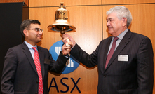 Brian Gilbertson (right) rings the bell for Jupiter's return to market.