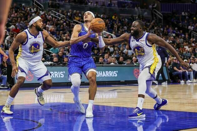 Magic ride balanced scoring to win over road-weary Warriors