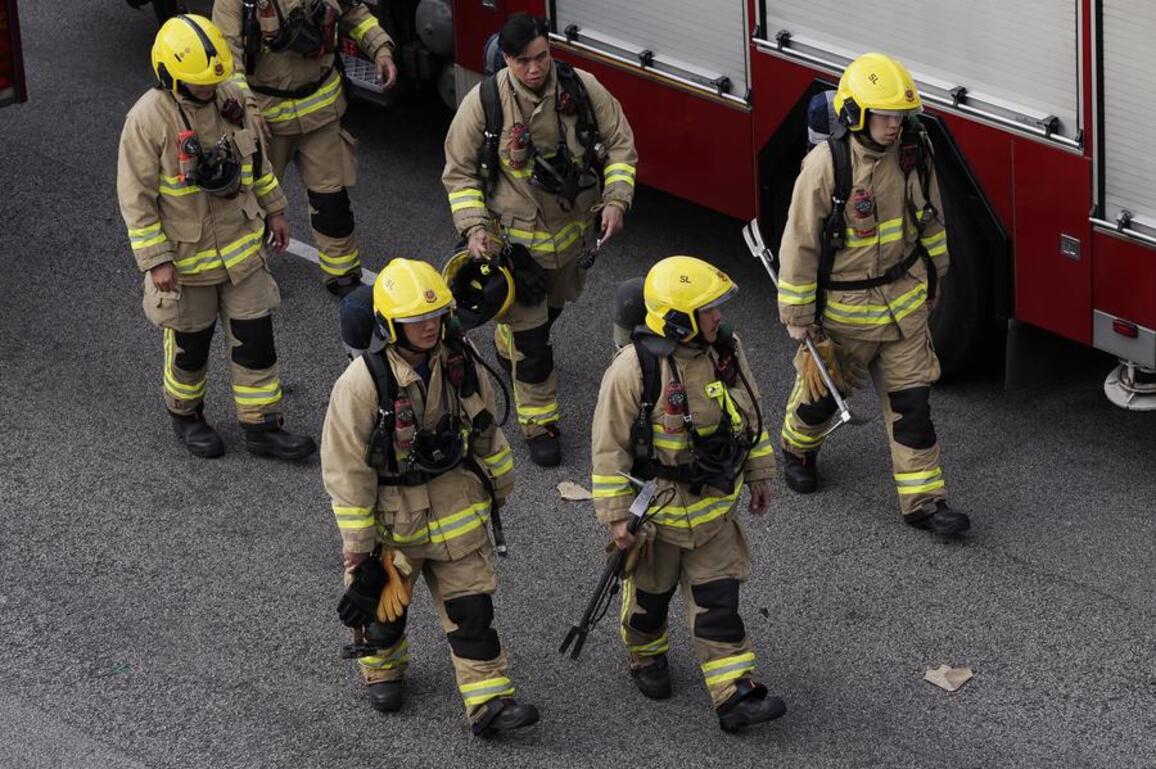 Feature: Floor by floor, door by door -- firefighters chase every hope in Hong Kong residential area fire