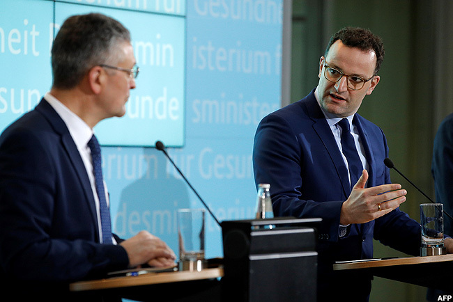  erman health minister ens pahn  speaks next to the president of the obert och nstitute r othar  ieler in erlin during a press conference on the situation after a erman man contracted the novel strain of coronavirus