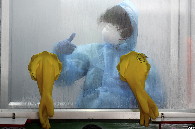   medical technician gestures at a 19 testing and sample collection centre in hennai ndia