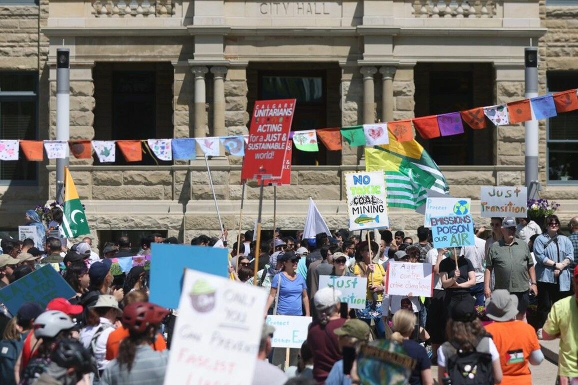 Ahead of G7 summit, protesters gather at city hall to 'raise voices'