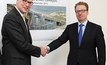thyssenkrupp Industrial Solutions and the Siemens process industries and drives division shake hands on the cooperation