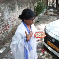Mimicry artist Ratan Ranjan performs a satirical skit dressed as CM Mamata Banerjee