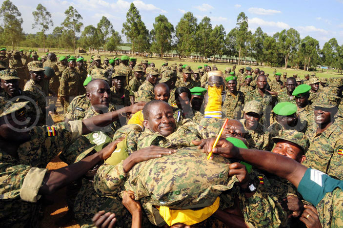   soldiers cheer up their colleague who exhibited acrobatic skills at a sendoff ceremony of  returnees at ingo ilitary chool ecember 232016