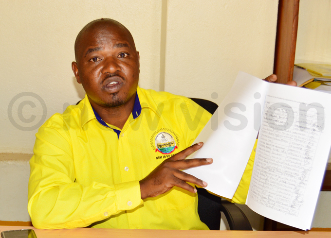  utalo displays a copy of petition to the resident over the conduct of umumba hoto by hamim aad