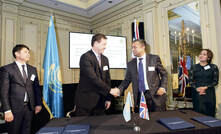 Sanzhar Kettebekov (left) shaking hands with Sam G. Bose, CEO and founder of IntelliSense.io (right)