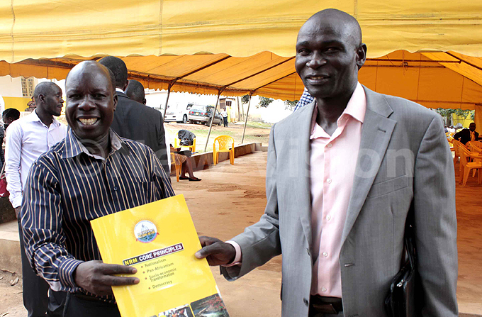 ulius con receives a document from the  electoral commission chairman anga doi  