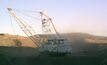 A dragline operates in dusty conditions