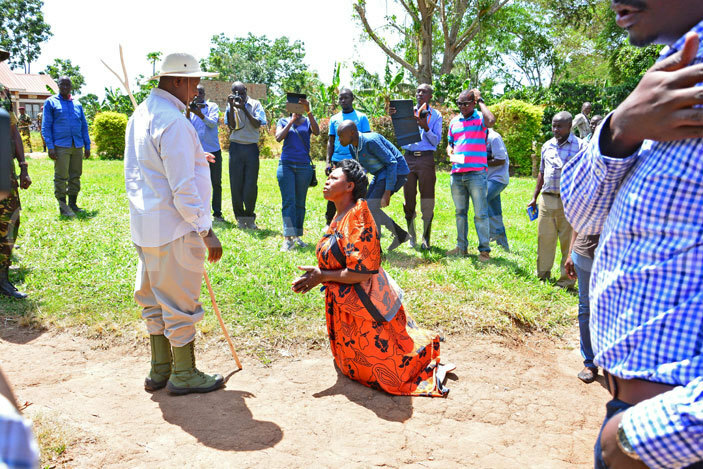 useveni is greeted by arriet sekweyama a poultry farmer 