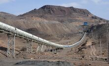 A conveyor transporting crushed ore from the crusher to the plant at the Sangan iron ore project