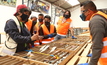  Solaris Resources geologists reviewing drill core at Warintza in Ecuador