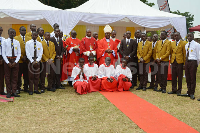  ishop ambert ainomugisha with the new prefects of t enrys ollege itovu after the thanksgiving mass