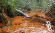 This waterway shows what activists say are signs of extensive iron oxide pollution.