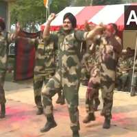 BSF personnel celebrate Holi at borders in West Bengal, Punjab, and Tripura