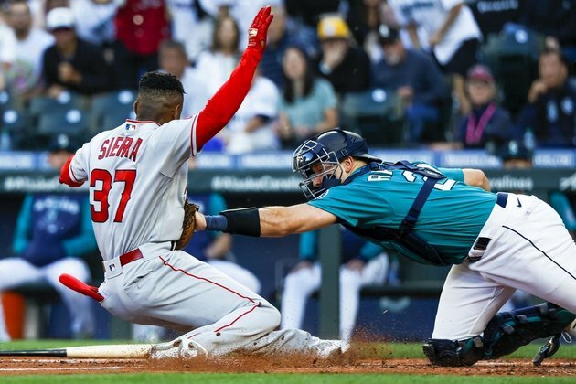 Angels blow lead in 9th, beat Mariners in 10th