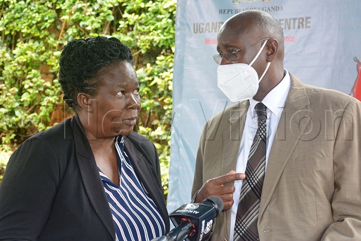 Rose Ademun Okurut Commissioner Animal Health interacting with Bright Rwamirama the State Minister for Animal Industry during press conference at Uganda Media Centre
