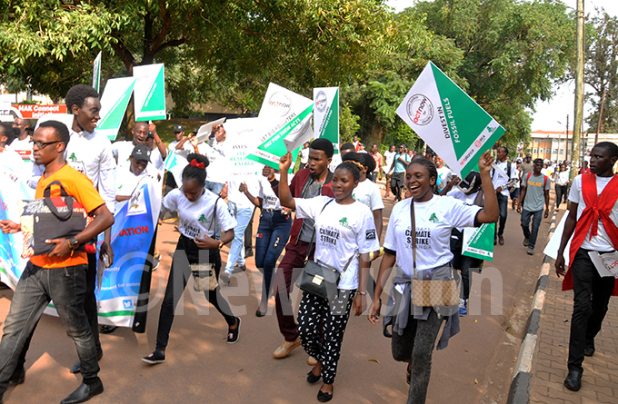  tudents of akerere niversity match to ganda arliament as they hold placards during the lobal climate strike on riday ept 20 2019 he global climate day of protest is to demand governments take urgent steps to prevent environmental disastershoto by icholas ajoba