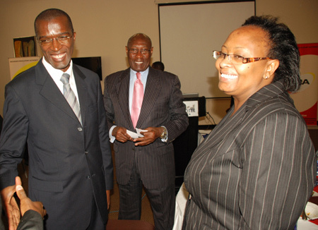 Executive Direct of  Insurance Regulatory Authority Ibrahim Kadunabi (left) the  Chairman of Uganda Insureres Association Mathew Koech  and the Regional Director of African Reinsurence  corporation  Eunice Mbogo after a breakfast meeting  of CEO of insurence comapanies in Kampala.. Photo by Wilfred Sanya 