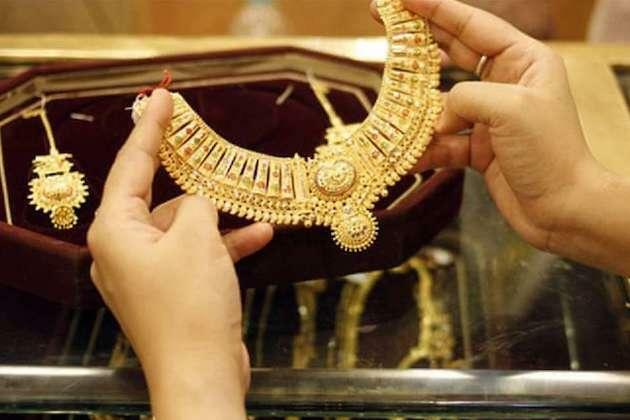 China's benchmark interbank gold prices lower Friday