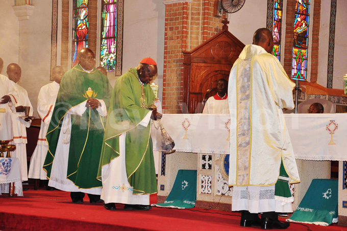  ardinal amala incenses the holy altar during the mass