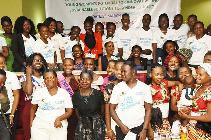  iss ganda uiin benakyo posing for a group photograph with some of the participants of the ational oung omens ialogue at mperial oyale hoto by palanyi sentongo