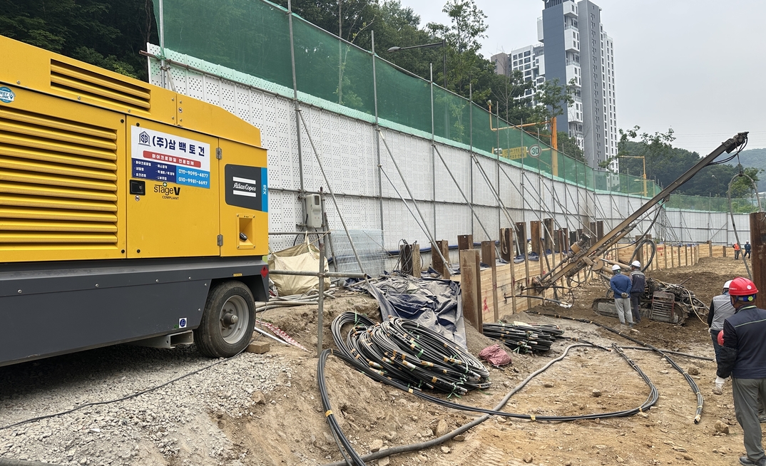 Atlas Copco's X28 portable air compressor supporting slope reinforcement in Gyeonggi Province, South Korea